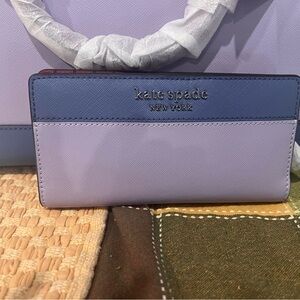 NWT purple lilac crossover. Includes wallet. $450
